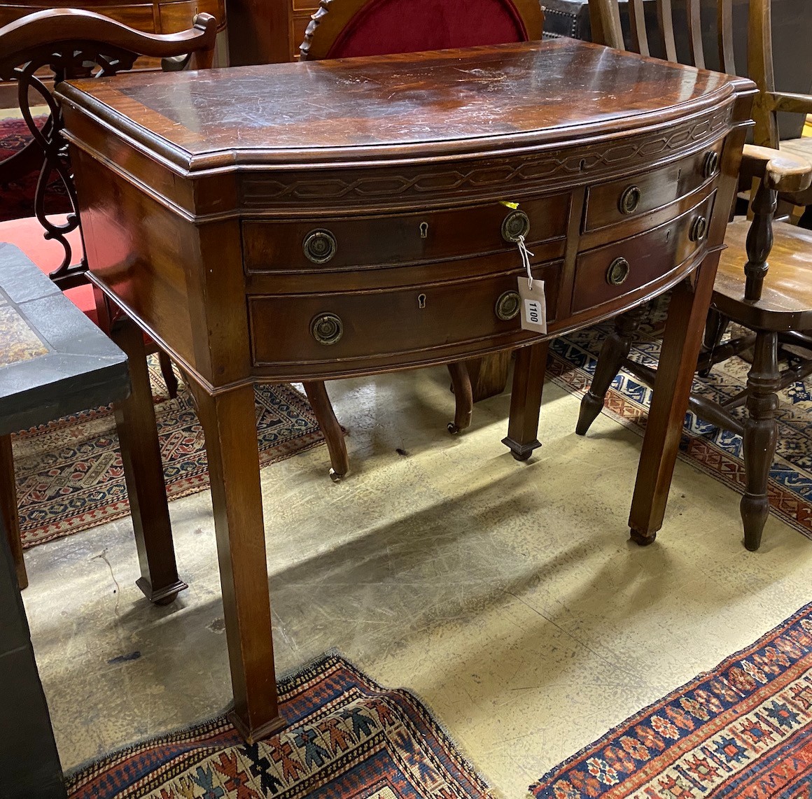 An early 20th century matched silver plated part canteen, in mahogany bow front four drawer table case, width 88cm, depth 49cm, height 85cm
